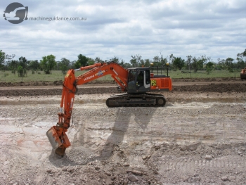 GPS Excavator Trimming Rock